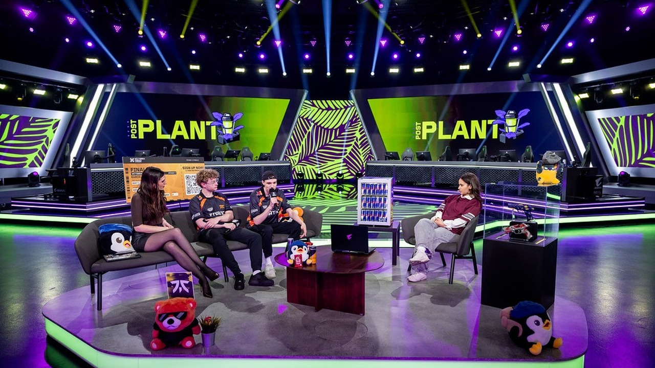 A FNATIC Valorant player stands at a live event