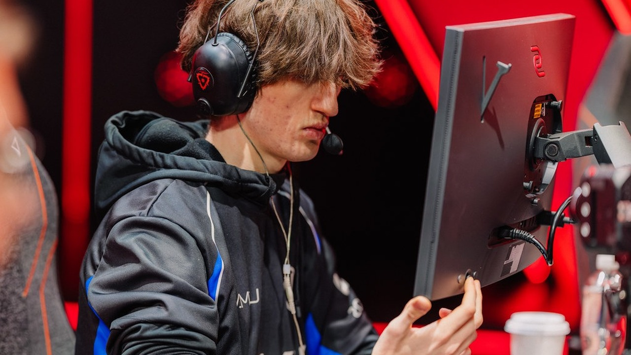 An ENVY Valorant player competes at a computer